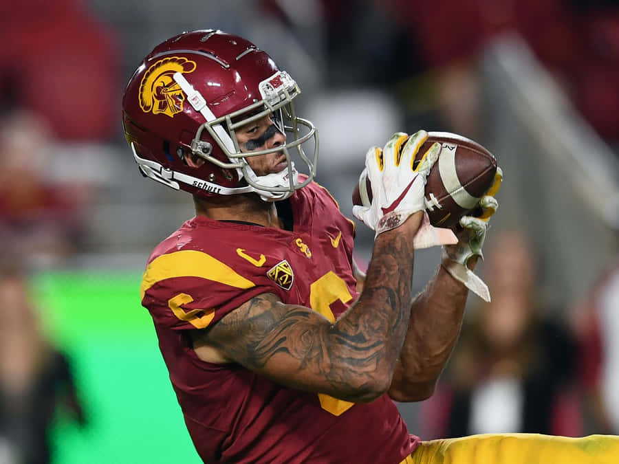 Football Player Catching Ball Wallpaper