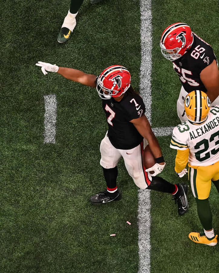 Football Player Celebrationon Field Wallpaper