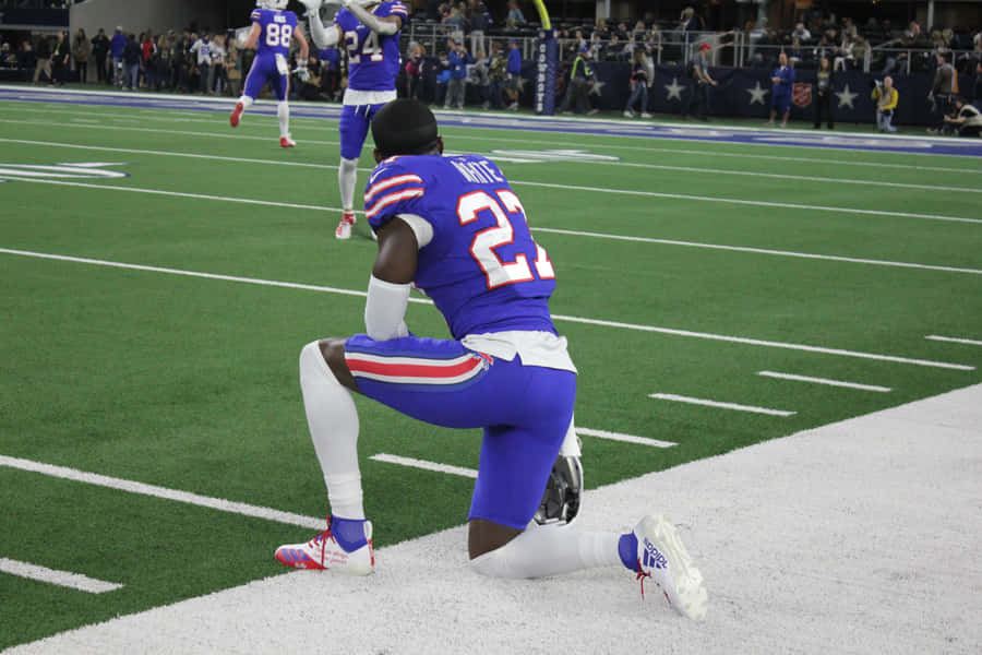 Football Player Celebrationon Field Wallpaper