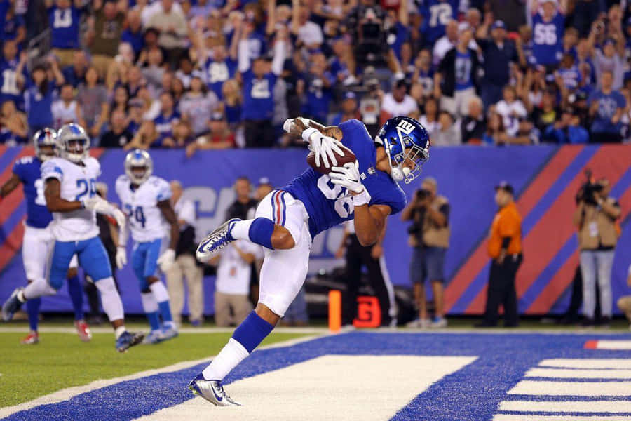 Football Player Diving Touchdown Catch Wallpaper