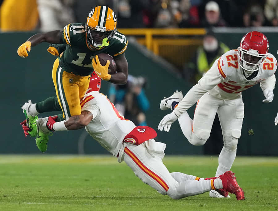 Football Player Evading Tackle Wallpaper