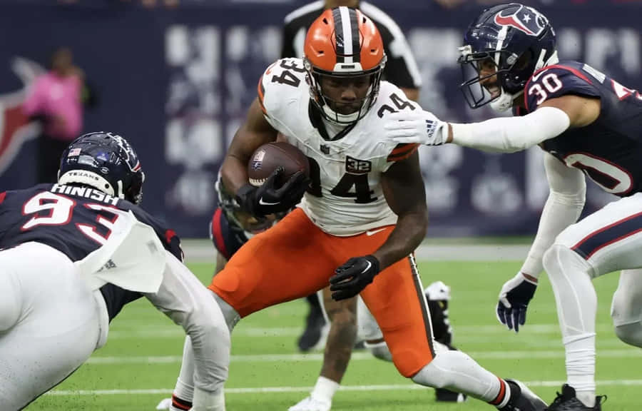 Football Player Evading Tackle Wallpaper