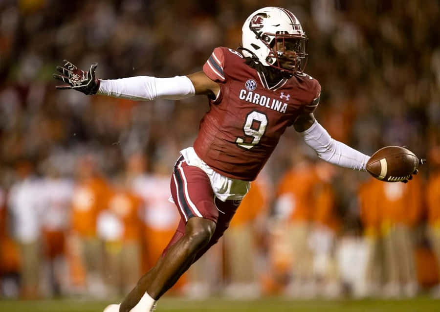 Football Player In Action Carolina Uniform Wallpaper