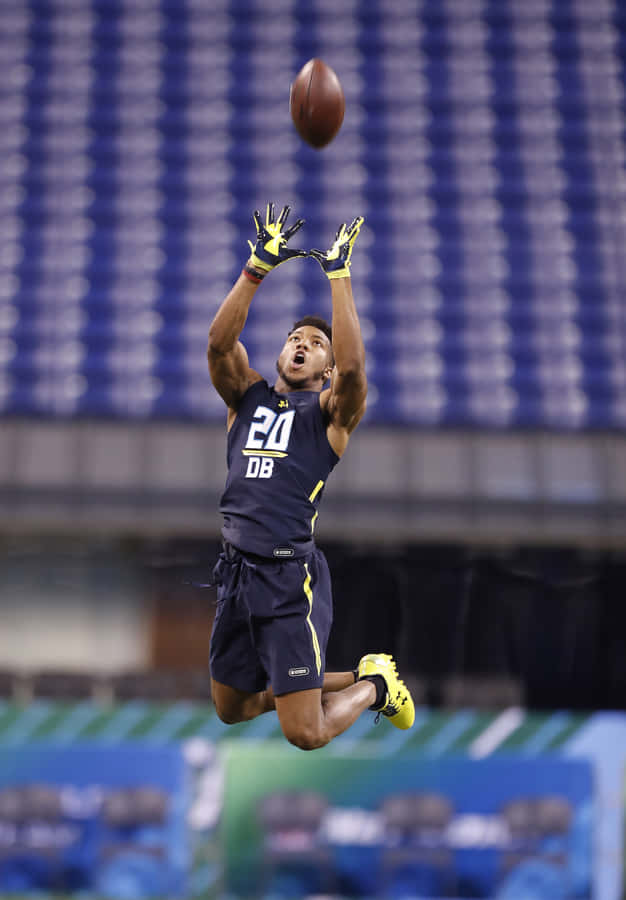 Football Player Leaping Catch Drill Wallpaper