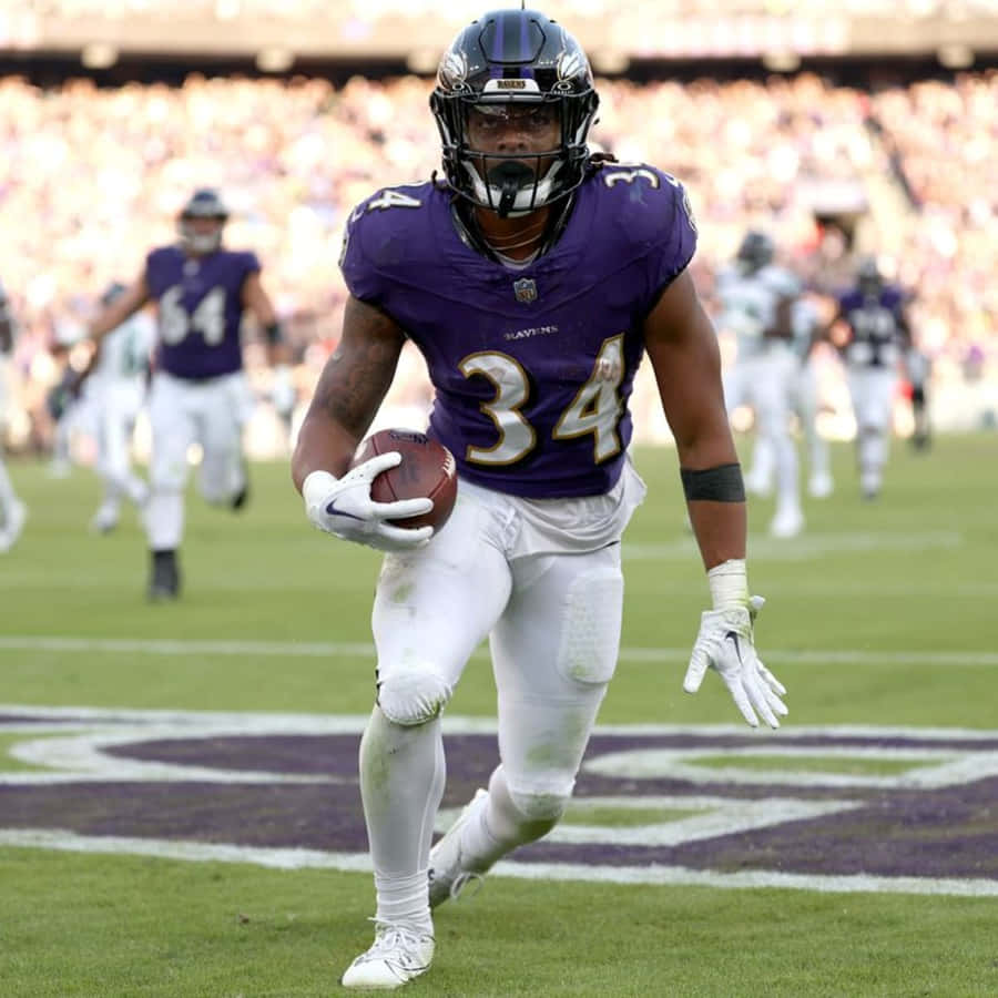 Football Player Number34 Action Shot Wallpaper