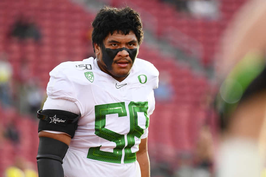 Football Player Number58 On Field Wallpaper