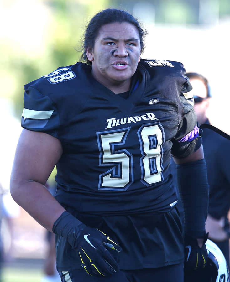 Football Player Number58 Thunder Jersey Wallpaper