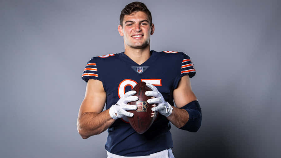 Football Player Portraitwith Ball Wallpaper