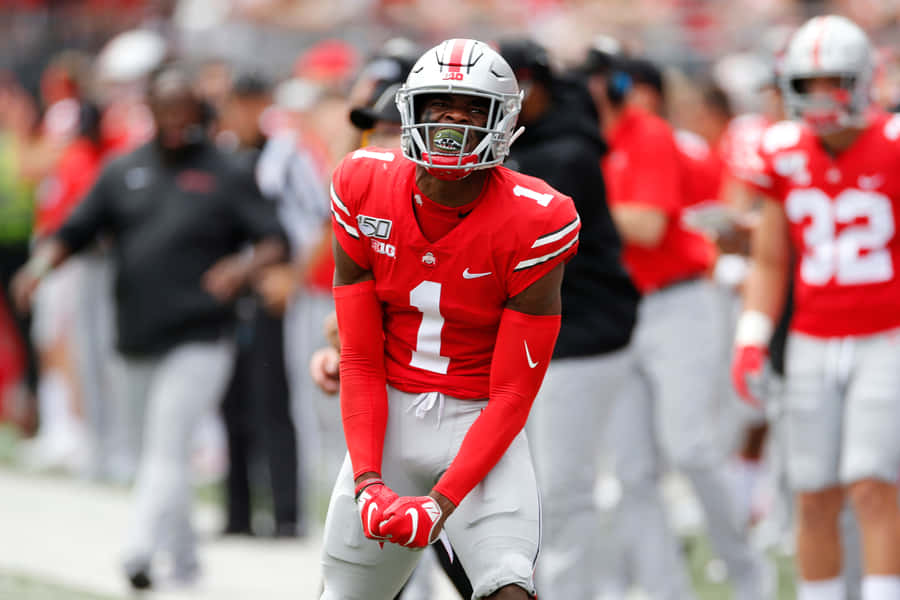 Football Player Red Uniform Number One Wallpaper