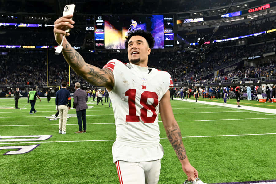 Football Player Selfie Celebration Wallpaper