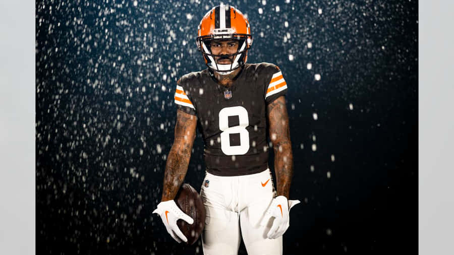 Football Player Snowy Backdrop Wallpaper