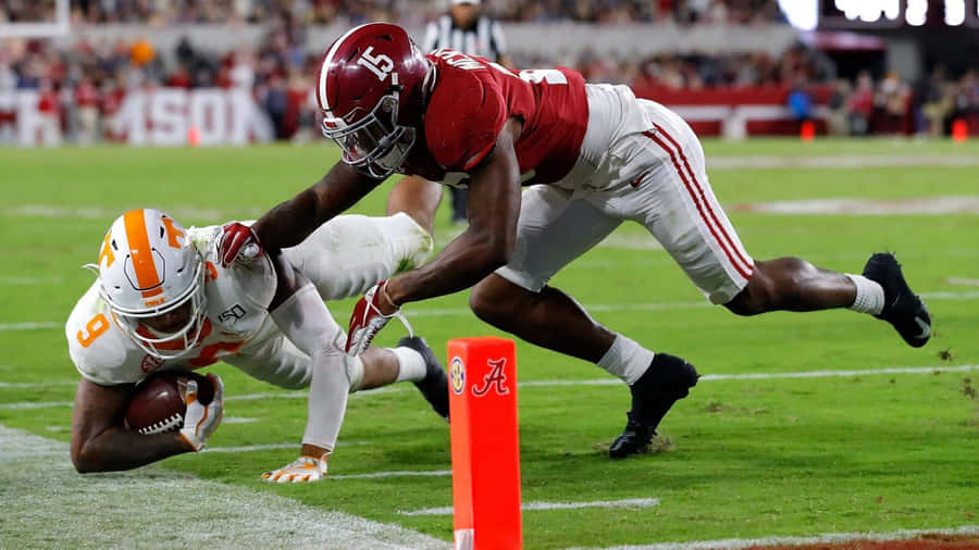 Football Player Tackling Near End Zone Wallpaper