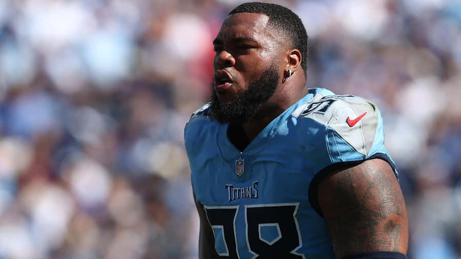 Football Playerin Action Pose Wallpaper