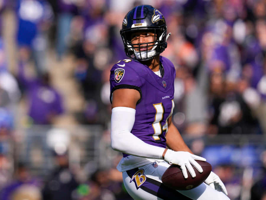 Football Playerin Purple Uniform Number14 Wallpaper