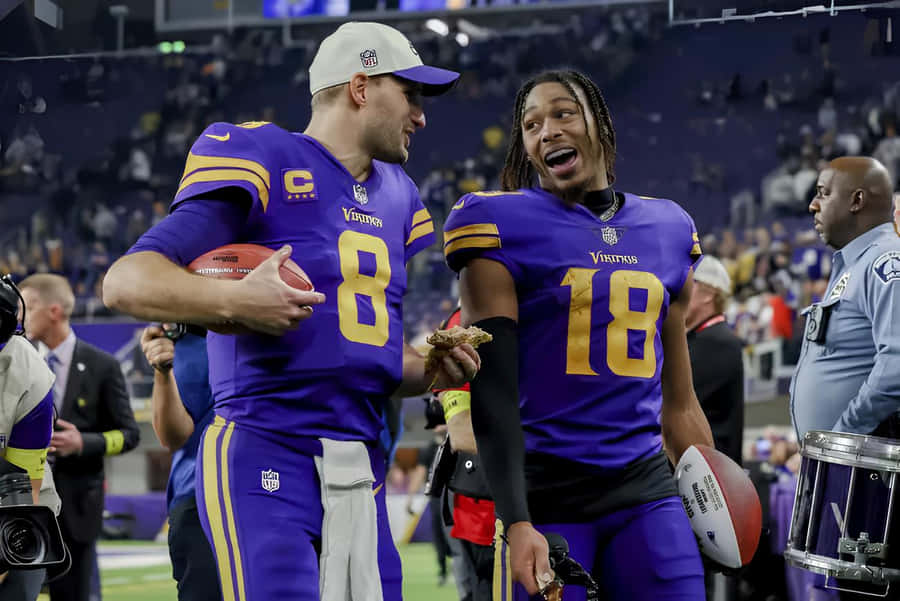 Football Players Celebrating Victory Wallpaper