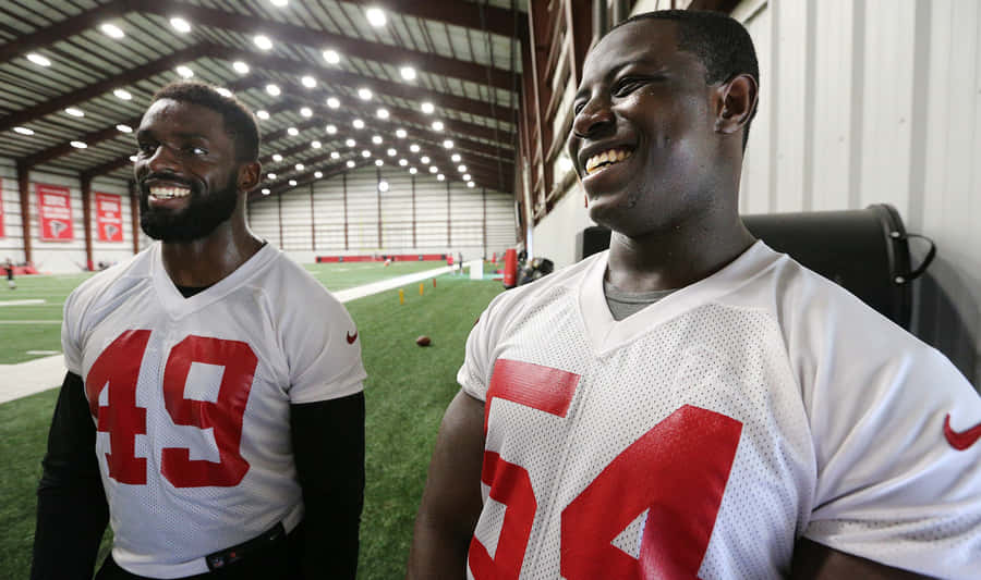 Football Players Laughing Indoors43and54 Wallpaper