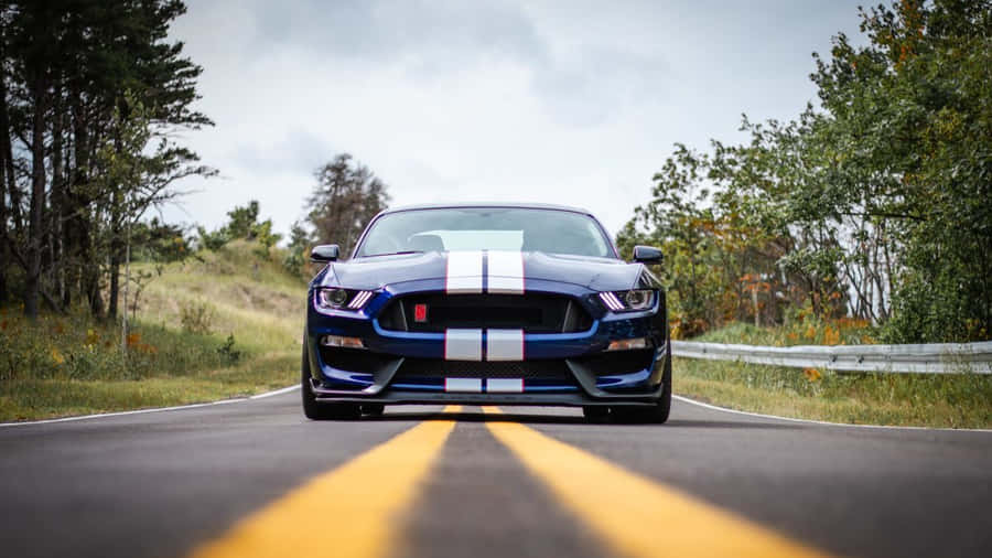 Ford Mustang Gt350r Roaring On Road Wallpaper