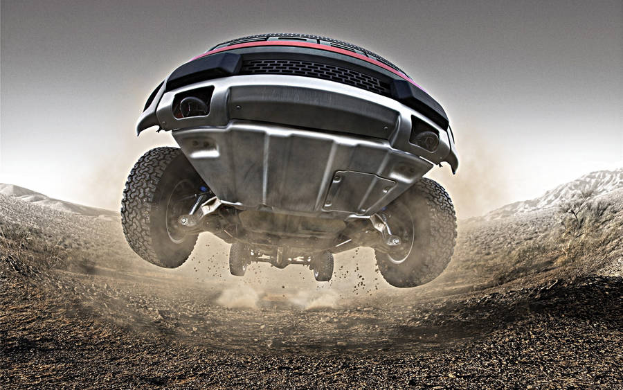 Ford Raptor Jumping Over Wallpaper