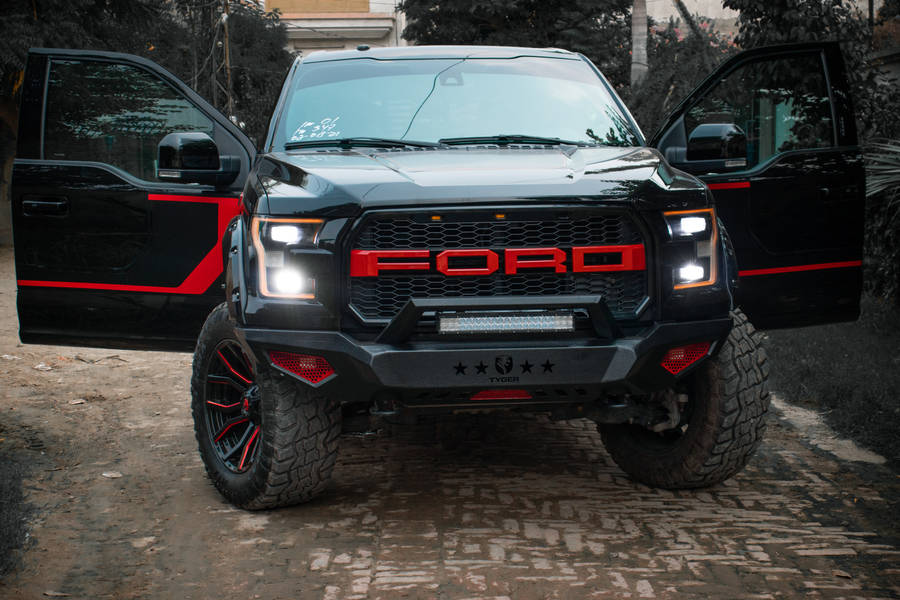 Ford Raptor With Custom Wordmark Logo Wallpaper