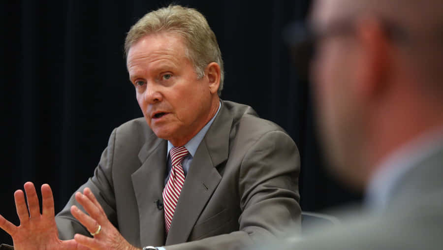 Former Senator Jim Webb Engaged In A Strategic Meeting Wallpaper