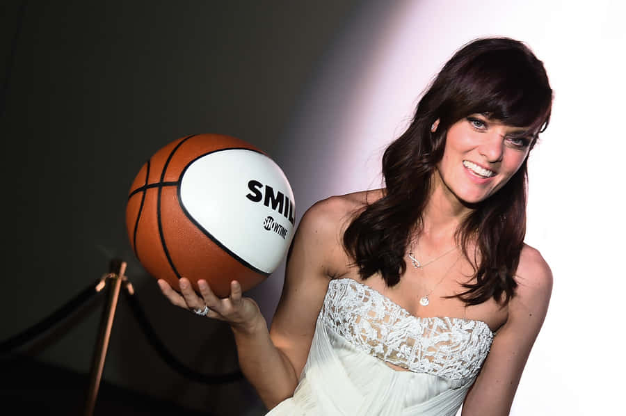 Frankie Shaw Smiling In A Striped Shirt Wallpaper