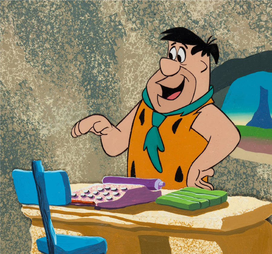 Fred Flintstone At Office Desk Comic Wallpaper
