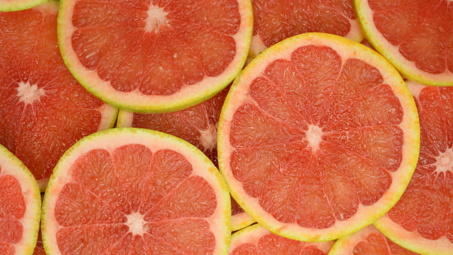 Fresh Pink Grapefruit Slices Close-up Wallpaper
