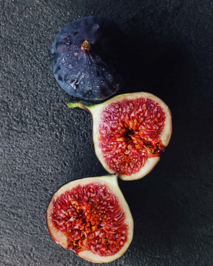 Fresh Purple Figs On A White Background Wallpaper