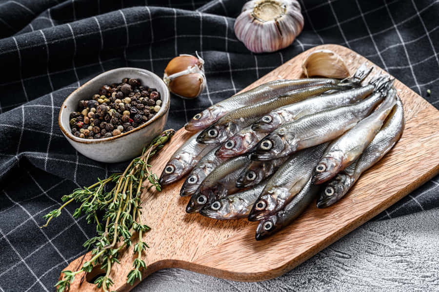 Fresh Smelt Fishon Cutting Board Wallpaper