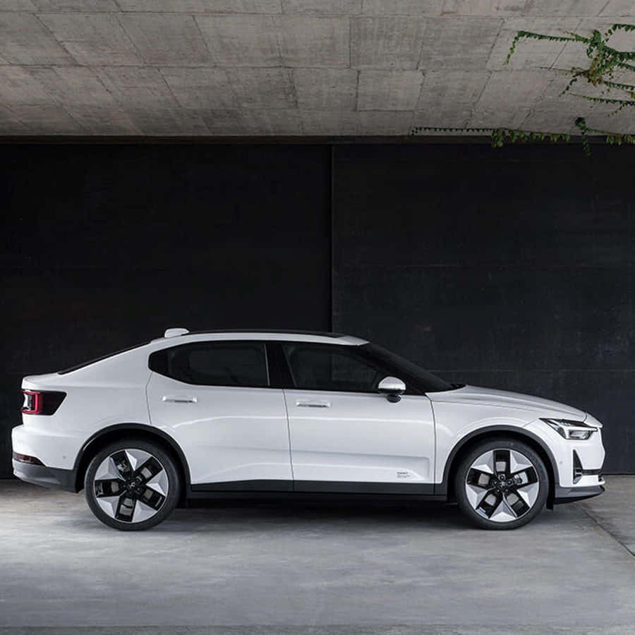 Futuristic Electric Vehicle On A Scenic Road Wallpaper