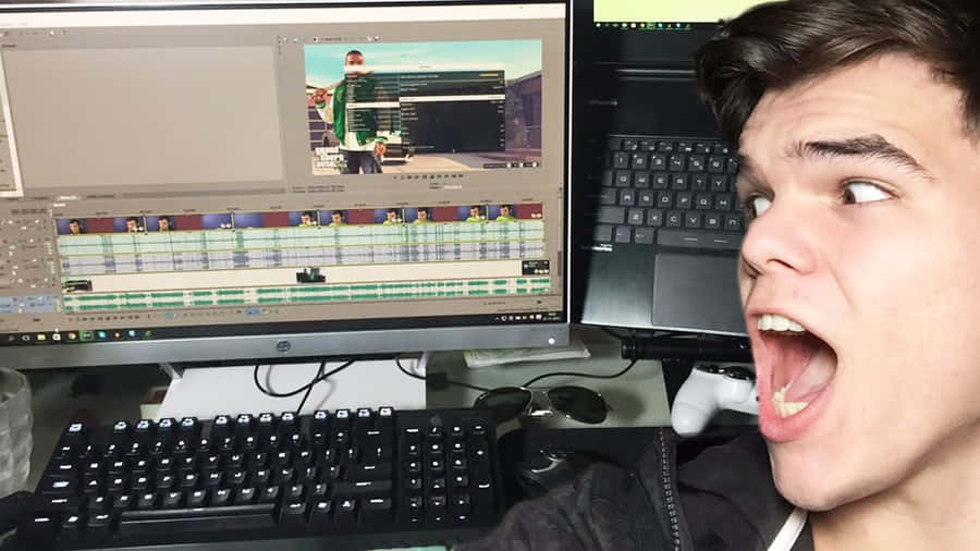 Gamer Video Editing Excitement Wallpaper