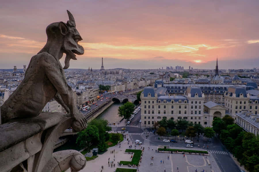 Gargoyle Overlooking Paris Sunset Wallpaper