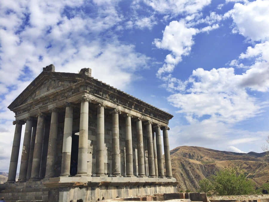Garni Temple Under Cloudy Sky Wallpaper