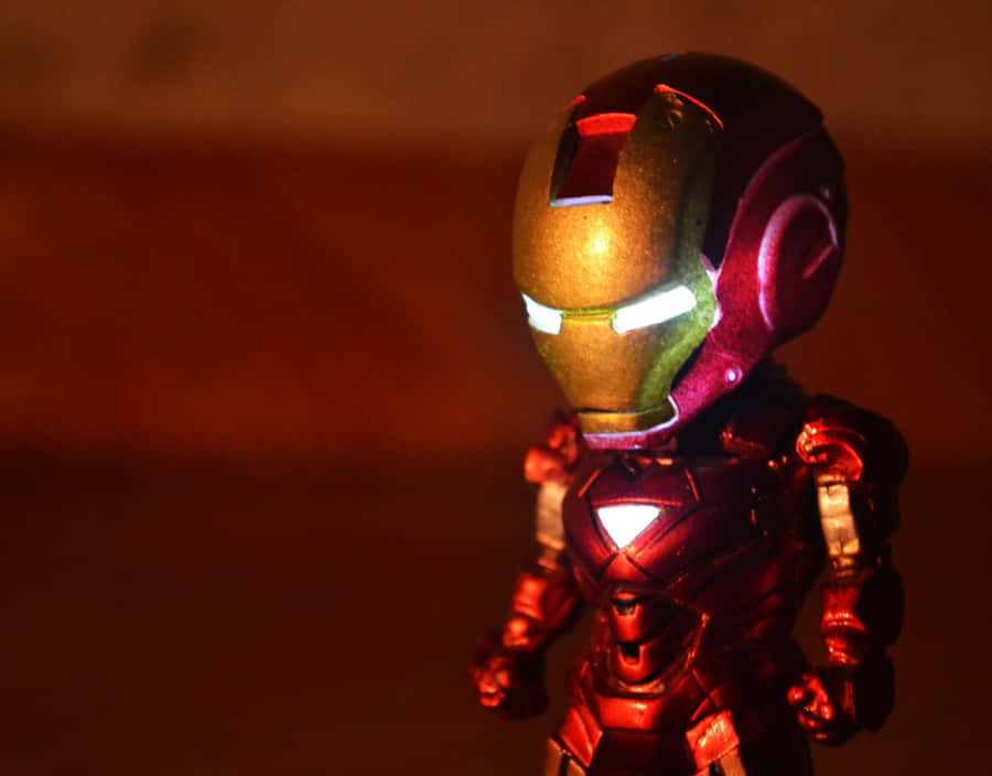 Gear Up For A Heroes Adventure With Iron Man Action Figures Wallpaper