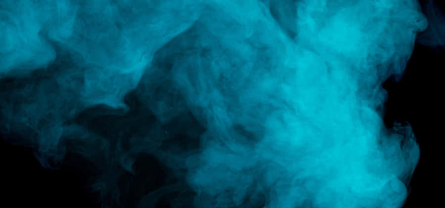 Get Lost In The Mesmerizing Swirl Of Smoke Blue. Wallpaper
