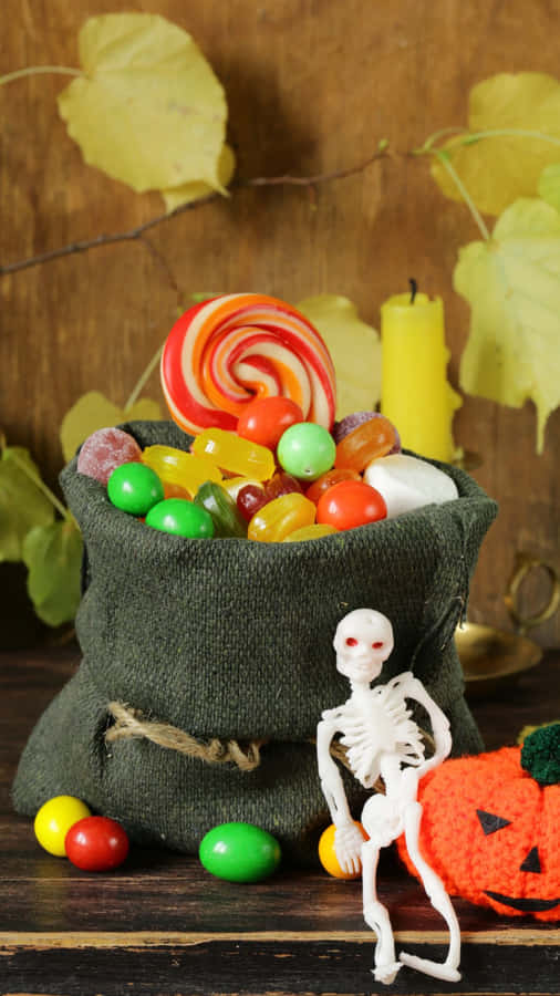 Get Ready For A Spooktacular Night Of Trick-or-treating With These Creative And Colorful Treat Bags! Wallpaper