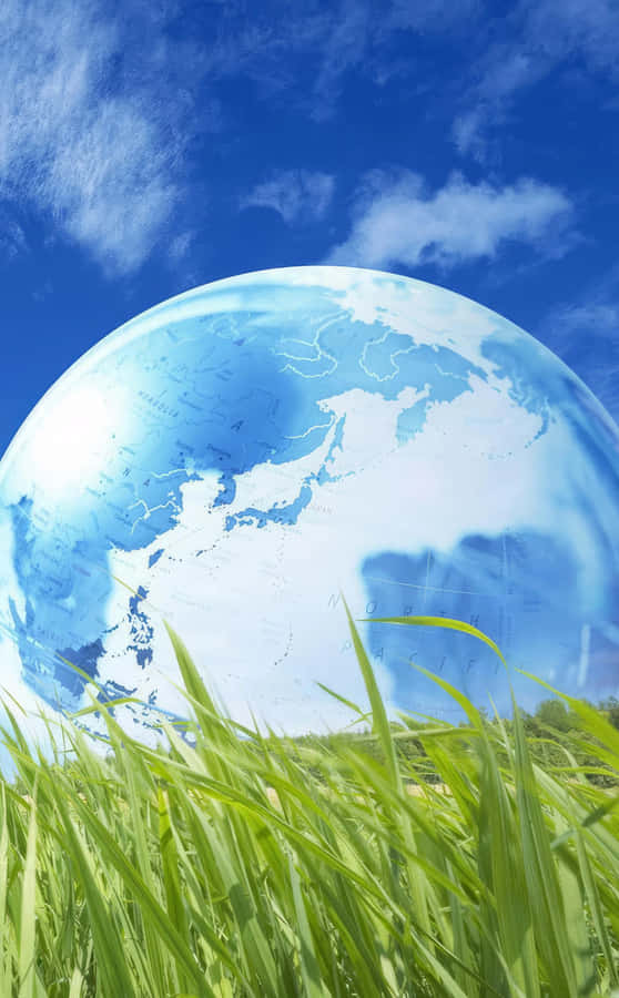 Giant Earth Over Green Field Wallpaper