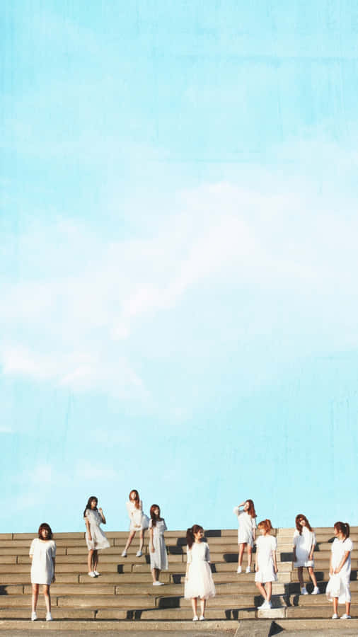 Girlsin White Dresseson Stairs Wallpaper