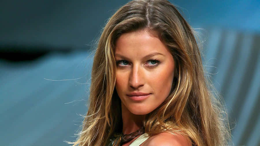 Gisele Bundchen Striking A Pose During A Fashion Shoot Wallpaper