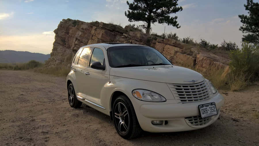 Gleaming Chrysler Pt Cruiser On The Road Wallpaper