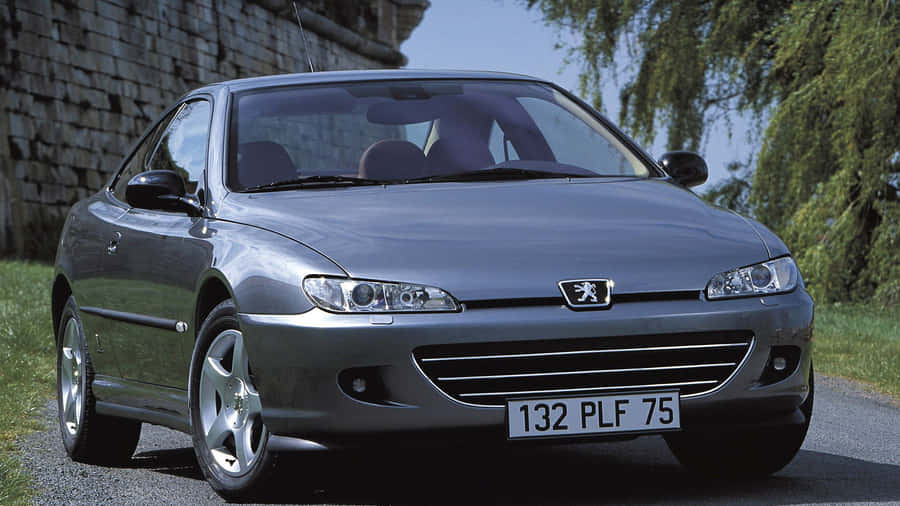 Gleaming Peugeot 406 On A Sunlit Streets Wallpaper