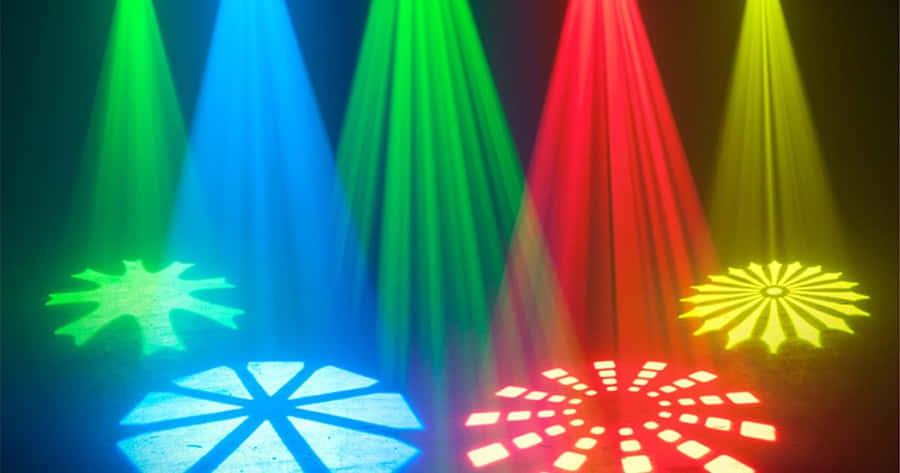 Glowing Dj Booth Against A Dark Concert Background Wallpaper