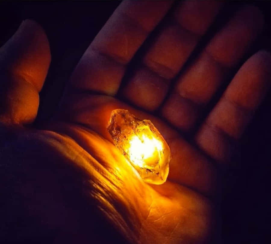 Glowing Gemstonein Hand Wallpaper