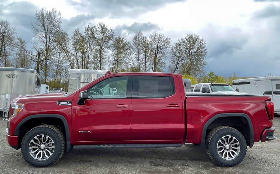Gmc Sierra Truck On A Mountain Road Wallpaper