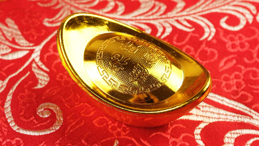 Gold Ingot On Red Fabric Wallpaper