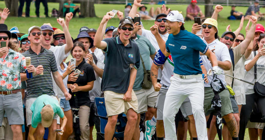 Golfer Celebrationwith Crowd Wallpaper