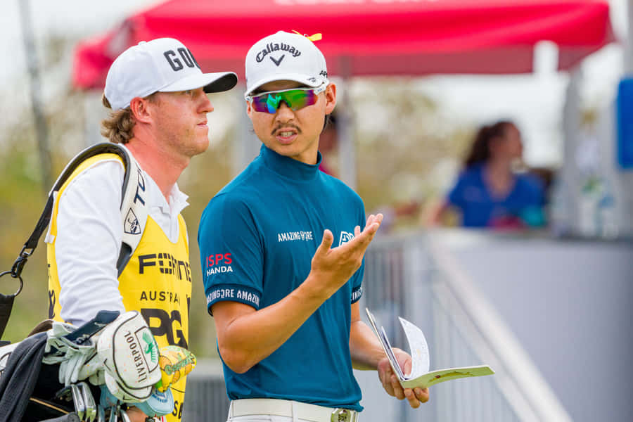 Golferand Caddie Strategy Discussion Wallpaper