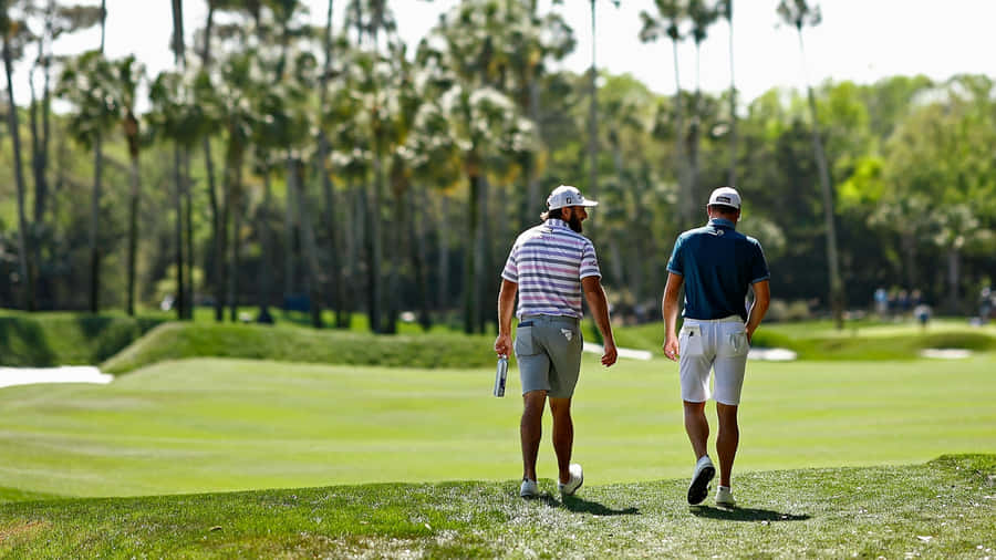 Golfers Walking The Fairwayat The Players Championship Wallpaper