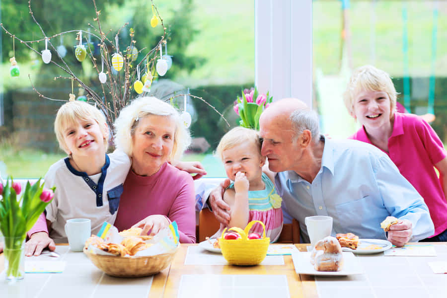 Grandparents With Grandchildren Celebrating Easter Wallpaper