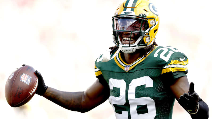 Green Bay Packers Player Celebratingwith Football Wallpaper